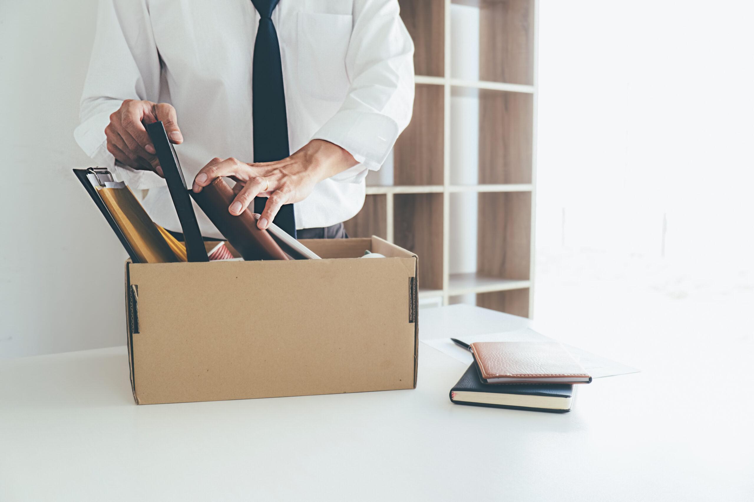 Sad dismissed businessman sitting outside the office after losin
